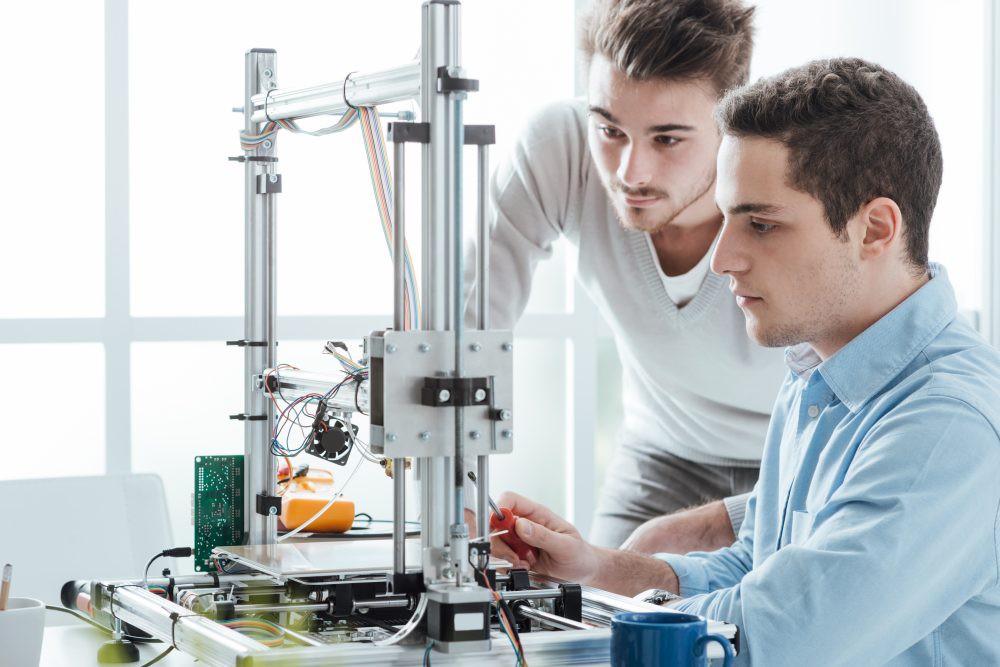 Young students using a 3D printer